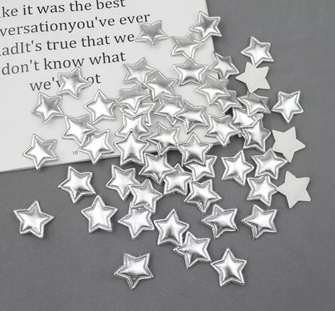 Metallic silver padded fabric stars, 25mm