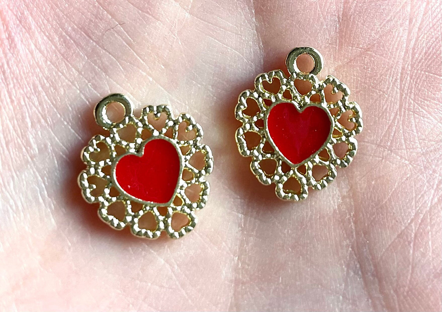 Red and gold heart charms,