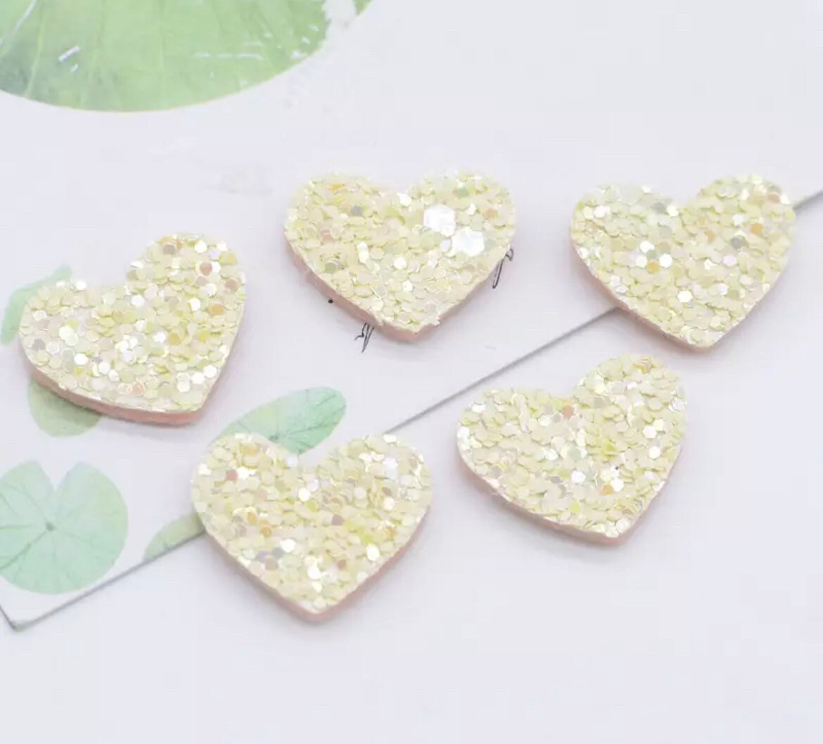 Heart shaped pale yellow embellishments, 20mm glitter