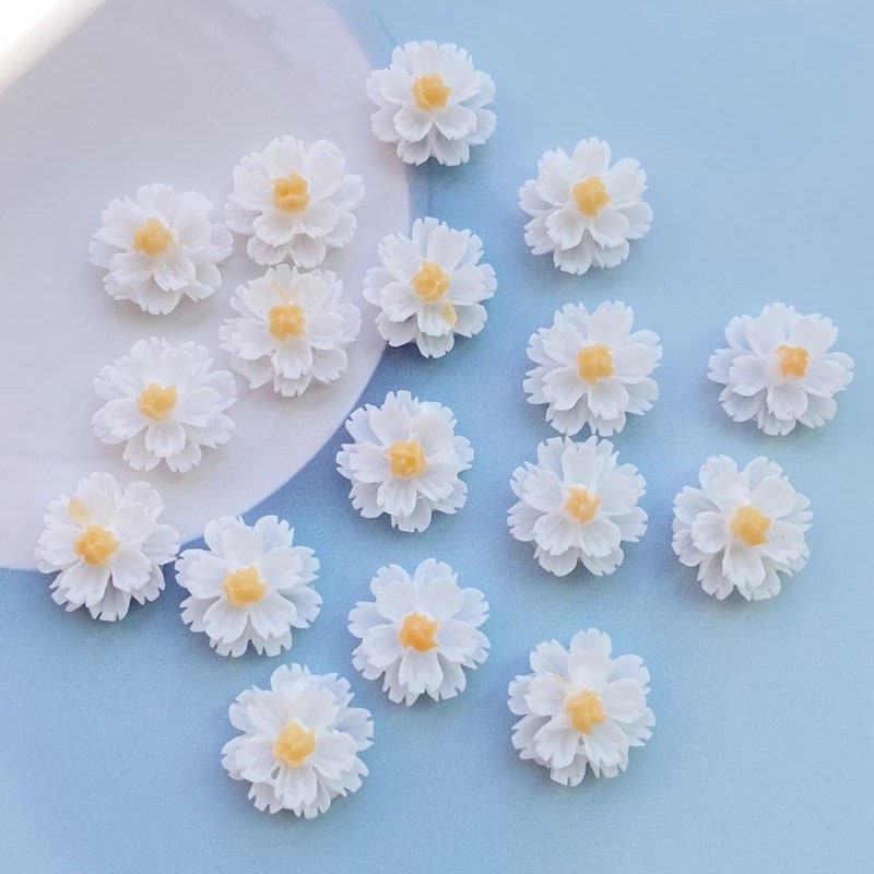 White flower cabochons, yellow centre 13mm