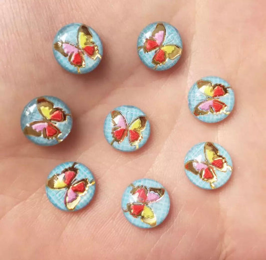 Round blue cabochon, butterfly 10mm